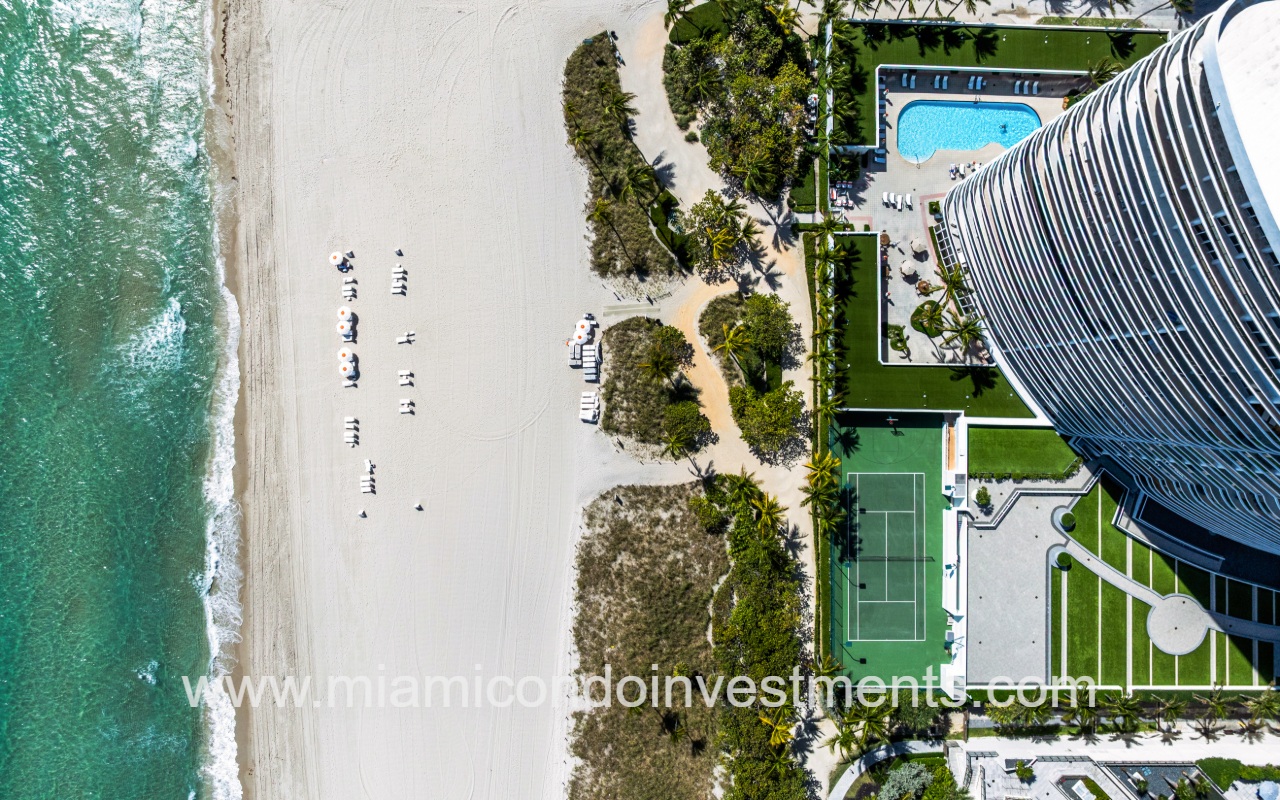 Majestic Tower top down view of condo building amenities and beach shoreline