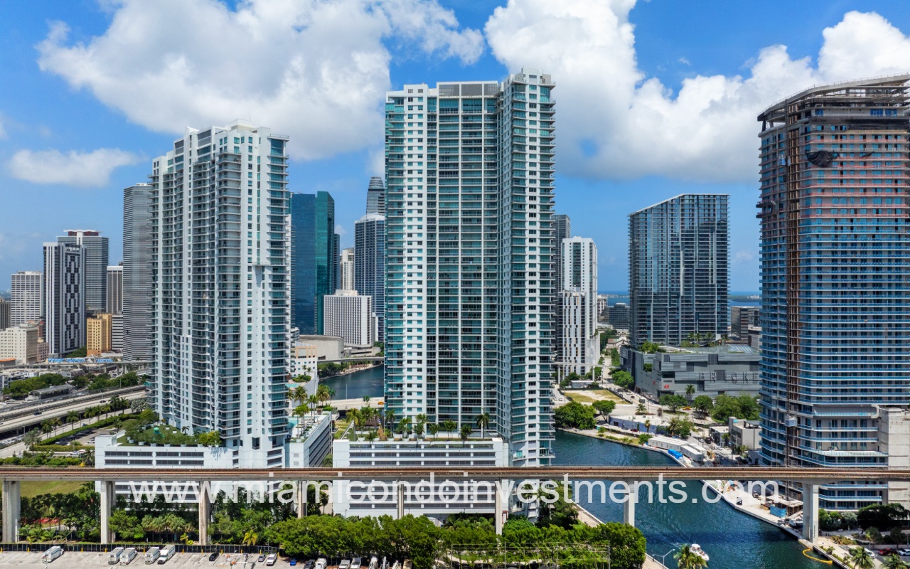 Mint condominium building with drone view of building side and surroundings