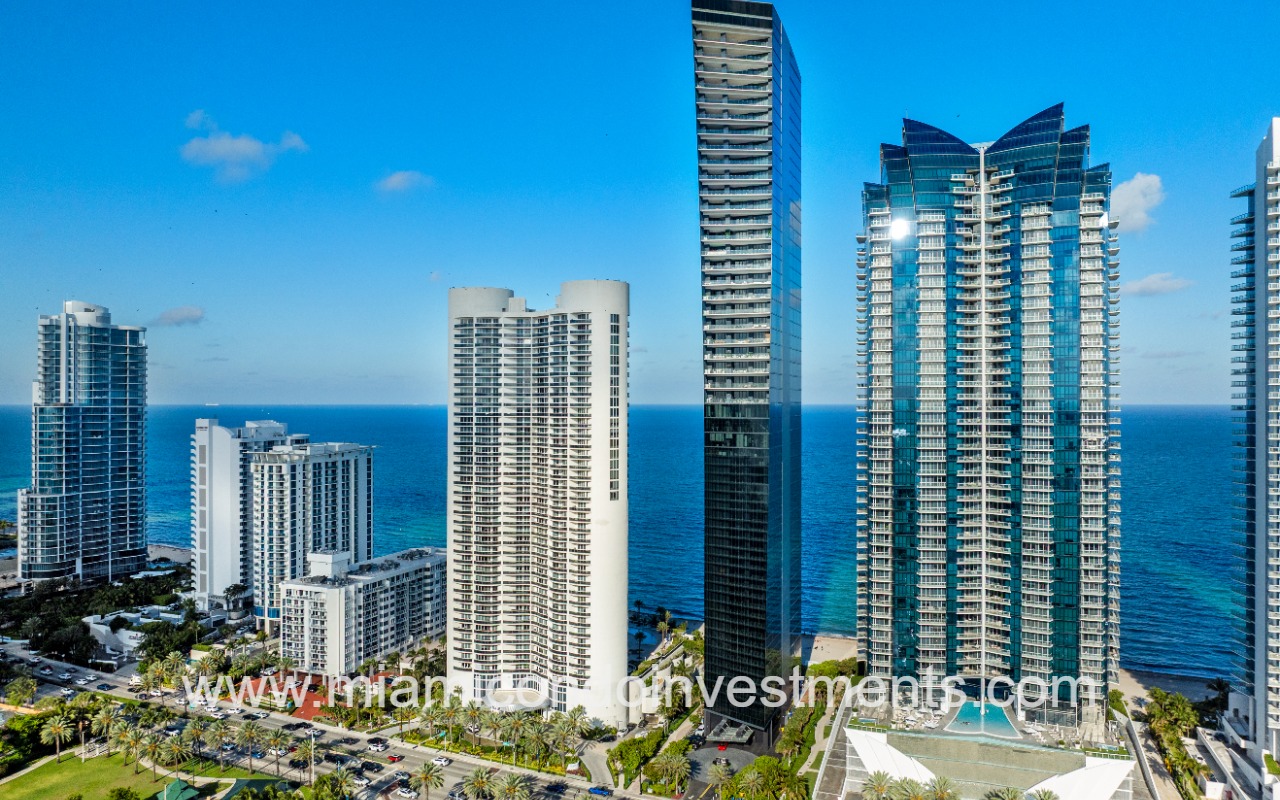 Muse drone facing front of condo building