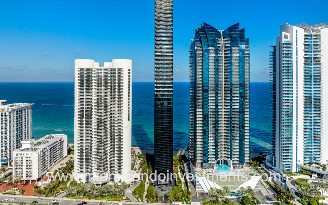 Muse drone facing front of condo building