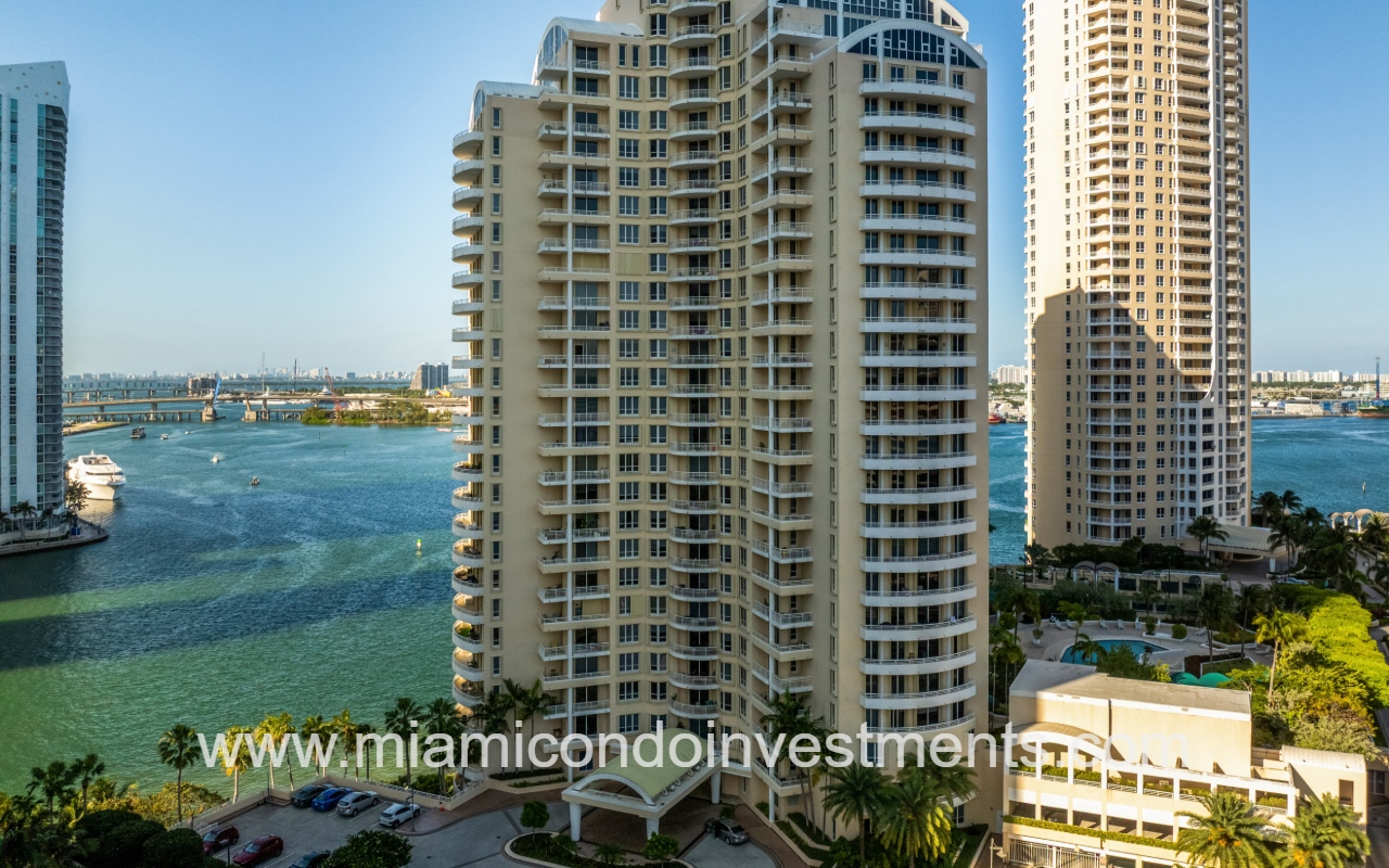 One Tequesta Point drone closeup facing front of condo building entry with waterfront backdrop