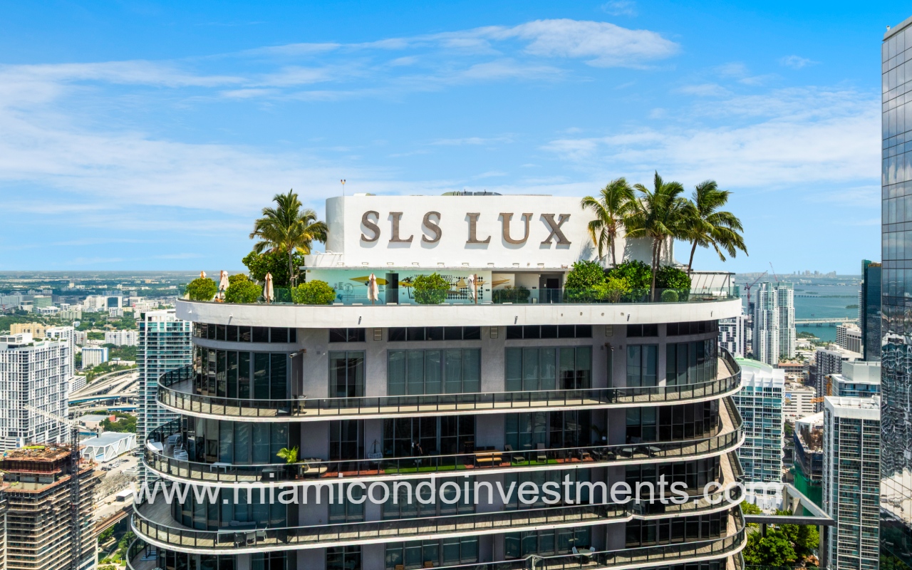 SLS Lux drone closeup of building top exterior with logo sign