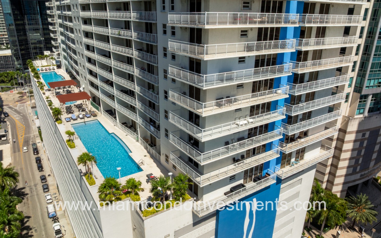 The Club at Brickell Bay drone view closeup angle of condo building profile and pool