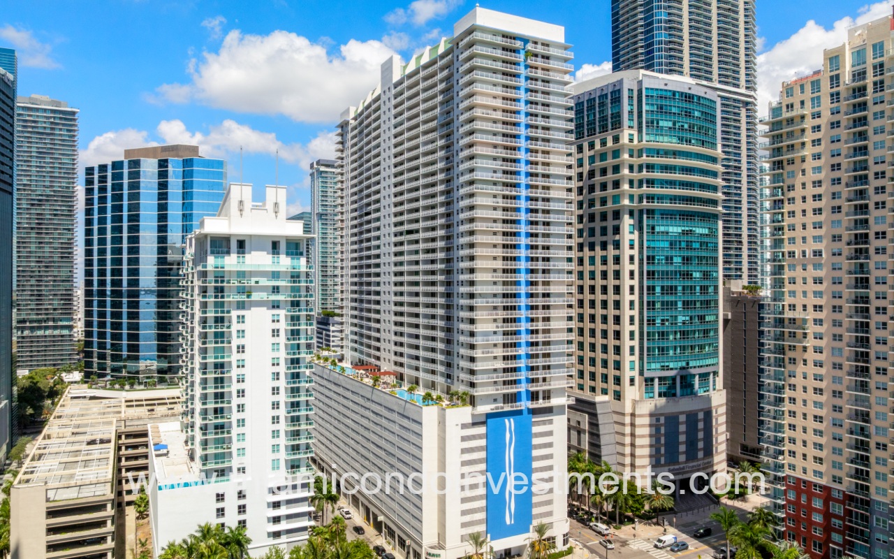 The Club at Brickell Bay drone view of the side of condo building and surrounding buildings