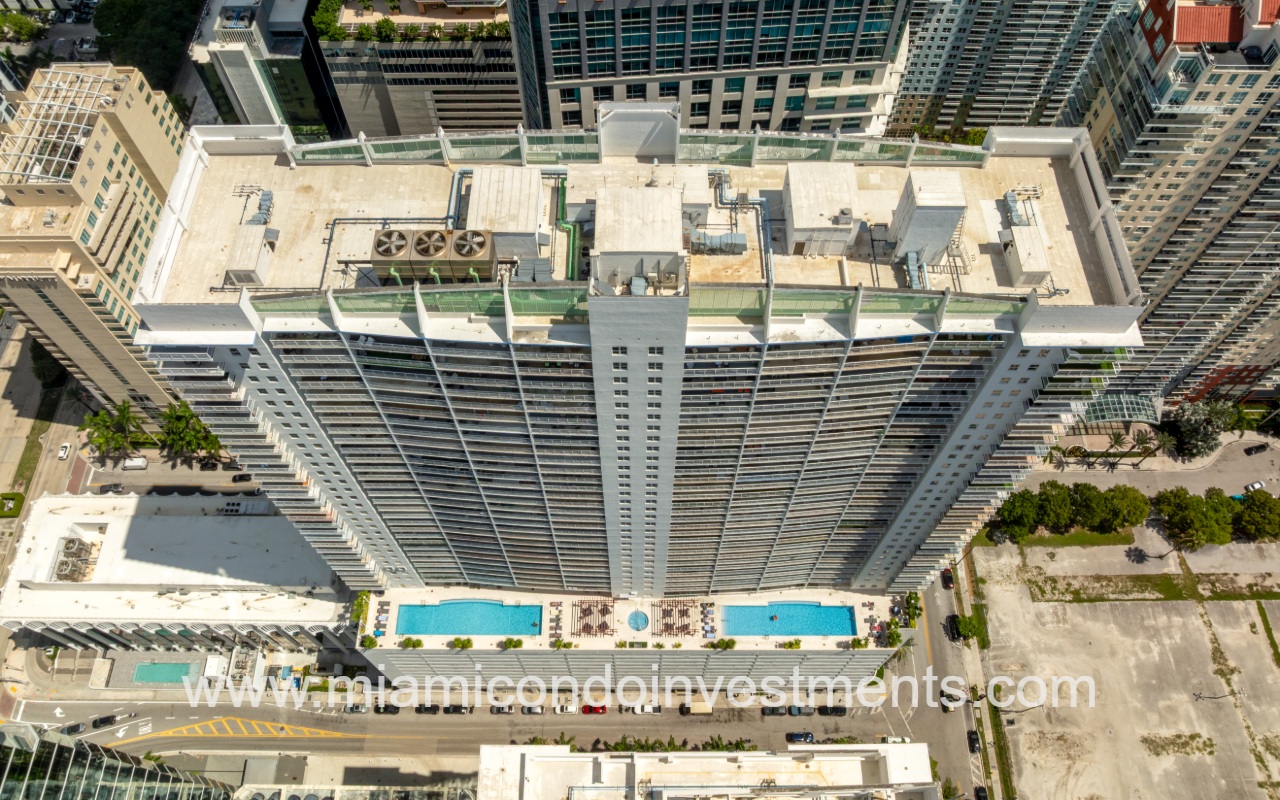 The Club at Brickell Bay drone top down view of condo building and pools