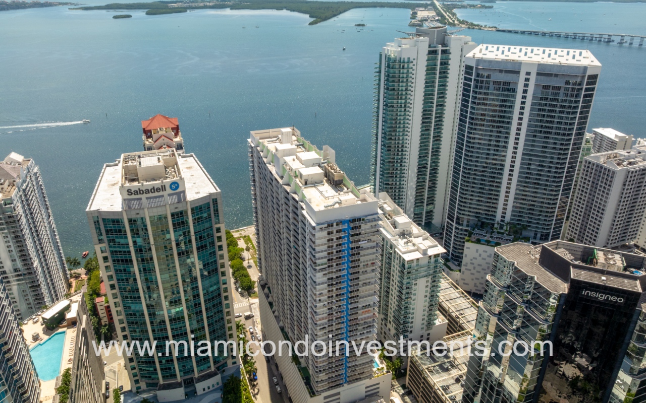 The Club at Brickell Bay drone view overlooking condo building and bay