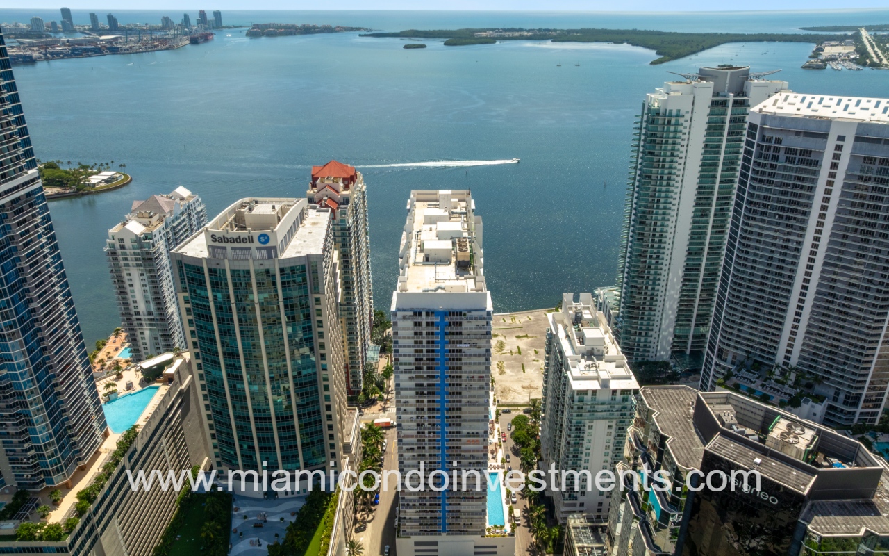 The Club at Brickell Bay drone view of condo building and bay