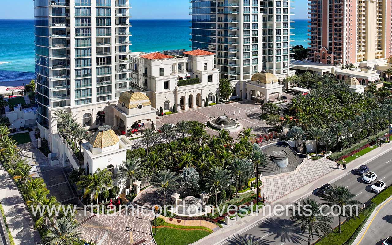 The Estates at Acqualina drone facing building front entry closeup