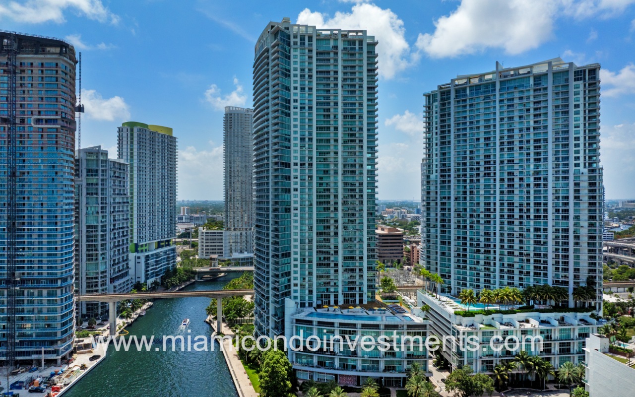The Ivy drone view overlooking condo building along river