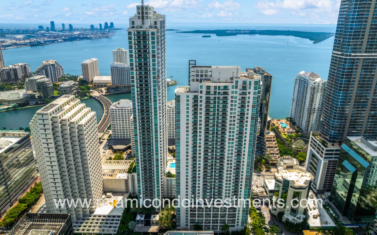 The Plaza on Brickell West drone facing condo building with bay backdrop