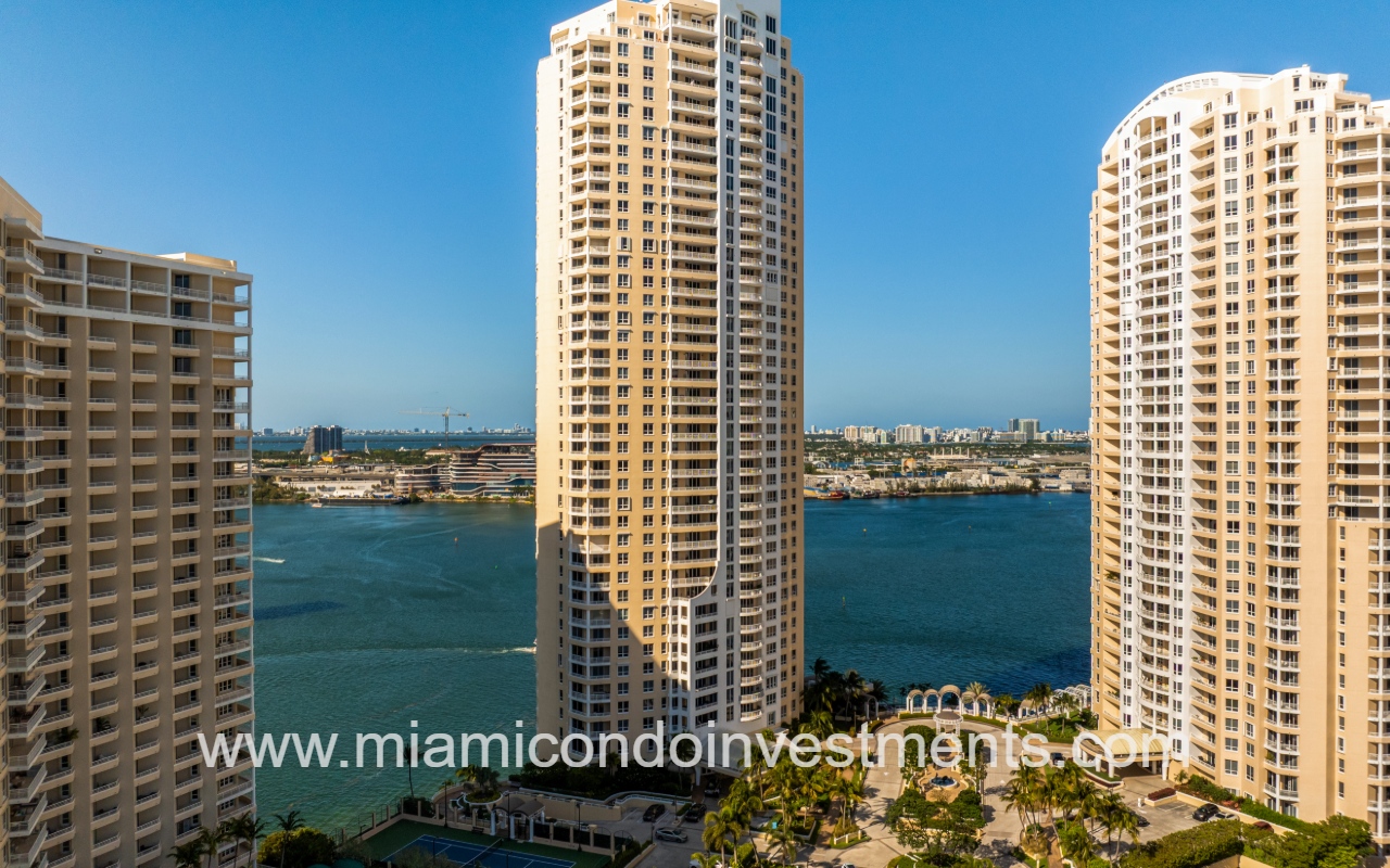 Three Tequesta Point drone view facing front of building with waterfront backdrop closeup