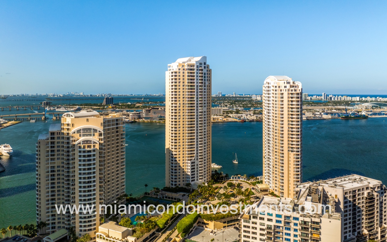 Three Tequesta Point drone view facing front of building with waterfront backdrop