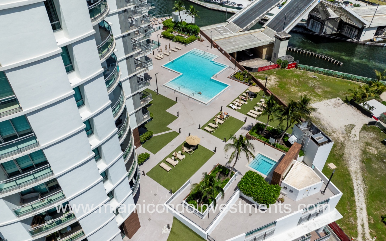 Wind drone overlooking pool area and condo building angle