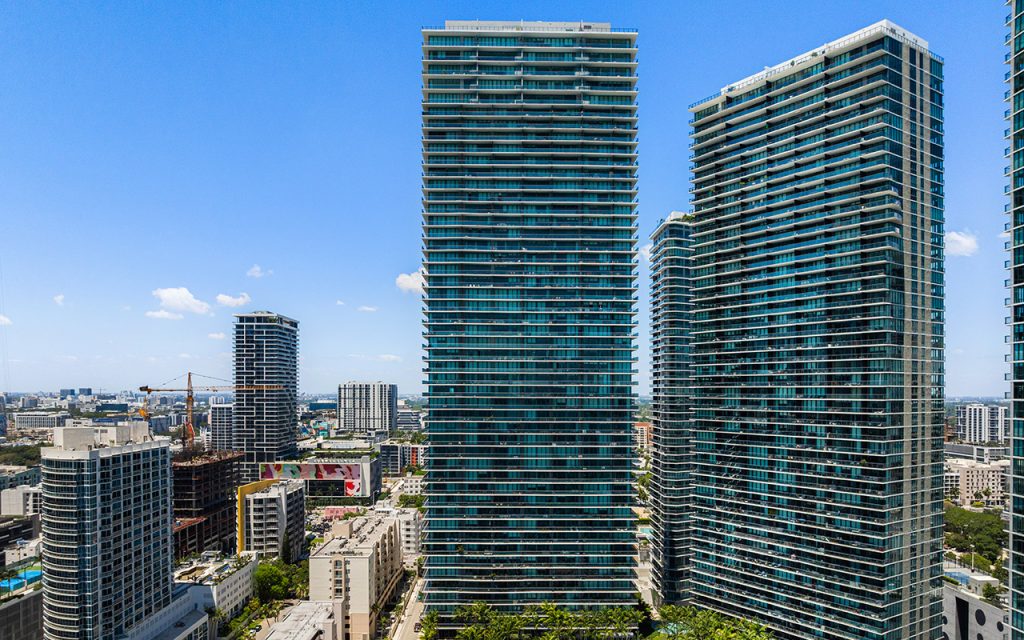 Gran Paraiso drone view of condo building exterior and pool