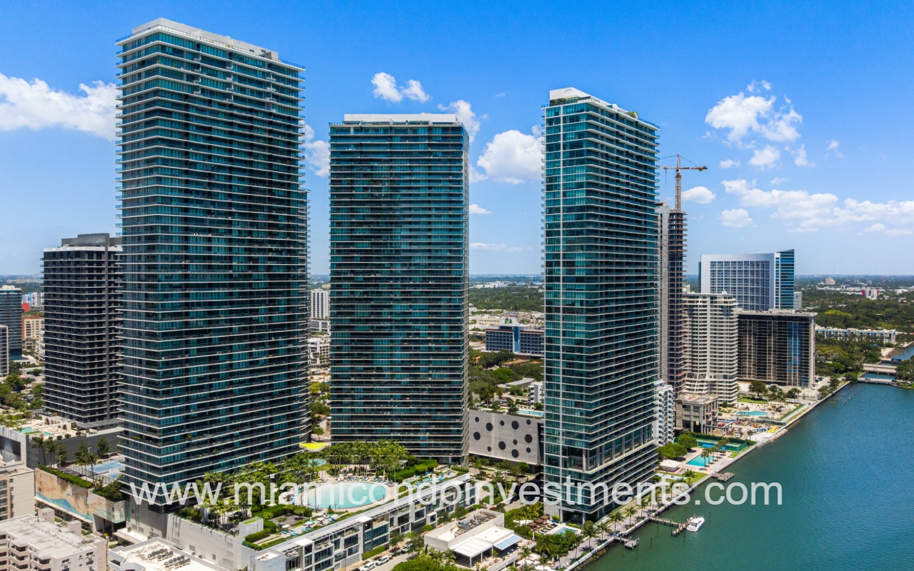 Gran Paraiso drone view of condo building and pool by waterway