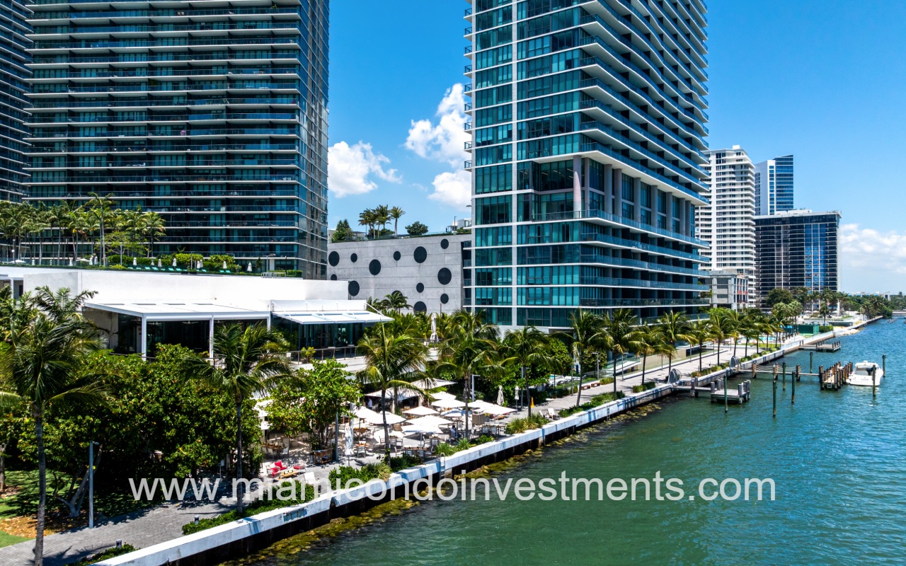 One Paraiso drone view from the bay facing the condo building and waterfront area