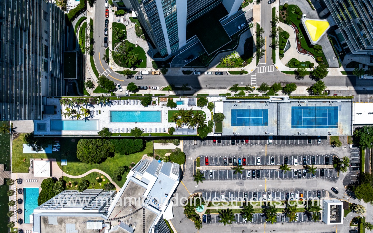 One Paraiso drone top down view of outdoor amenities and parking