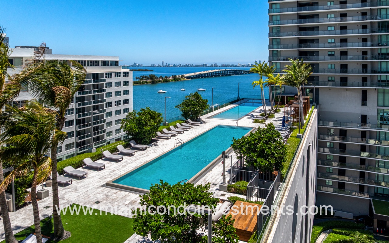 One Paraiso drone long view of pool overlooking bay
