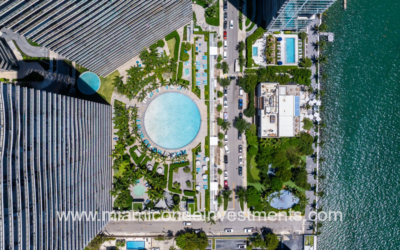Paraiso Bay drone top down view of condo building pool area