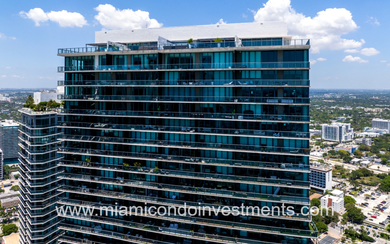 Paraiso Bay drone facing top part of condo building exterior
