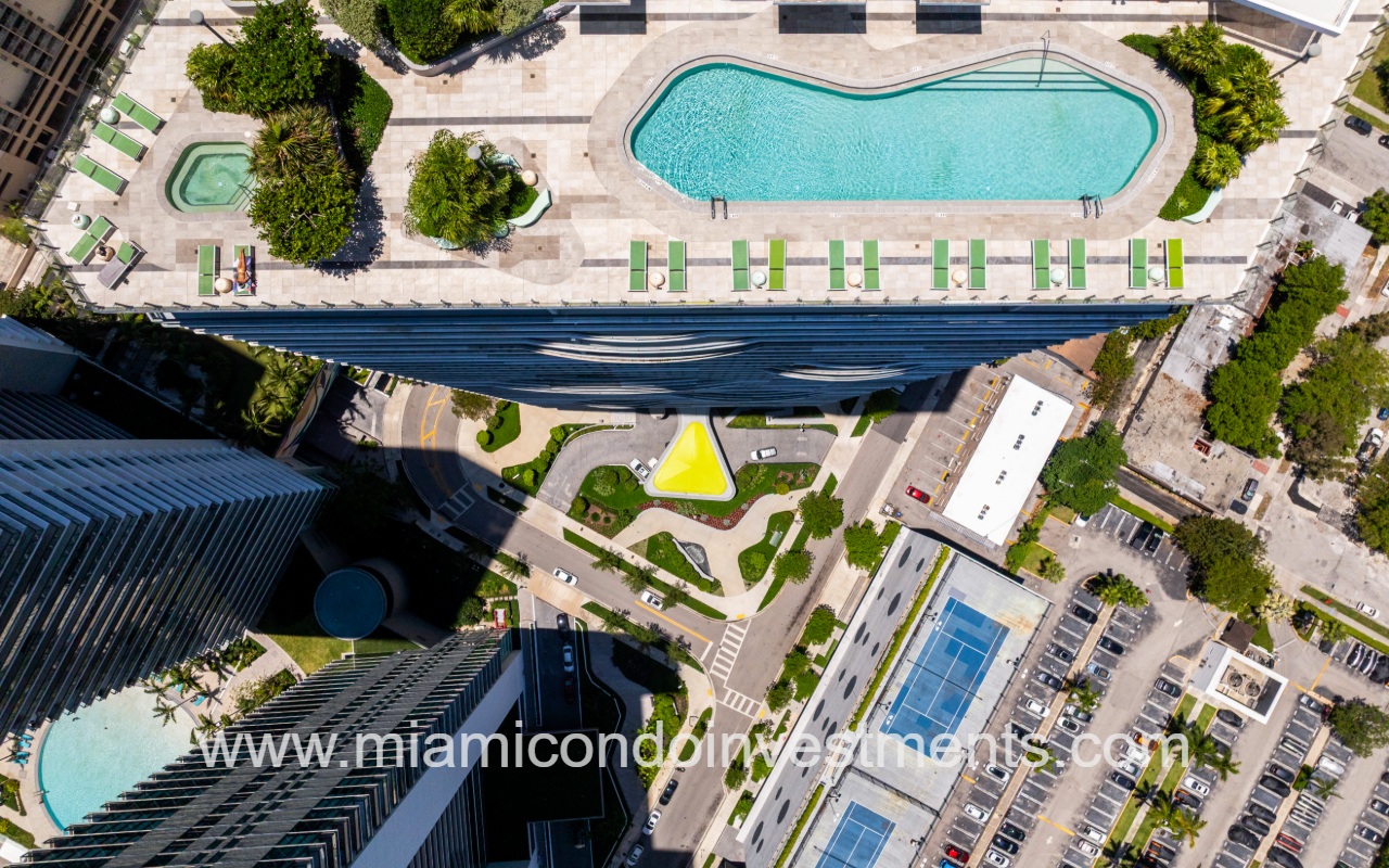 Paraiso Bayviews drone aerial view of condo building rooftop pool and lower amenities