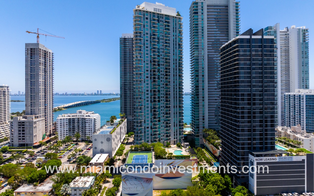 Paraiso Bayviews drone view facing condo building with bay backdrop
