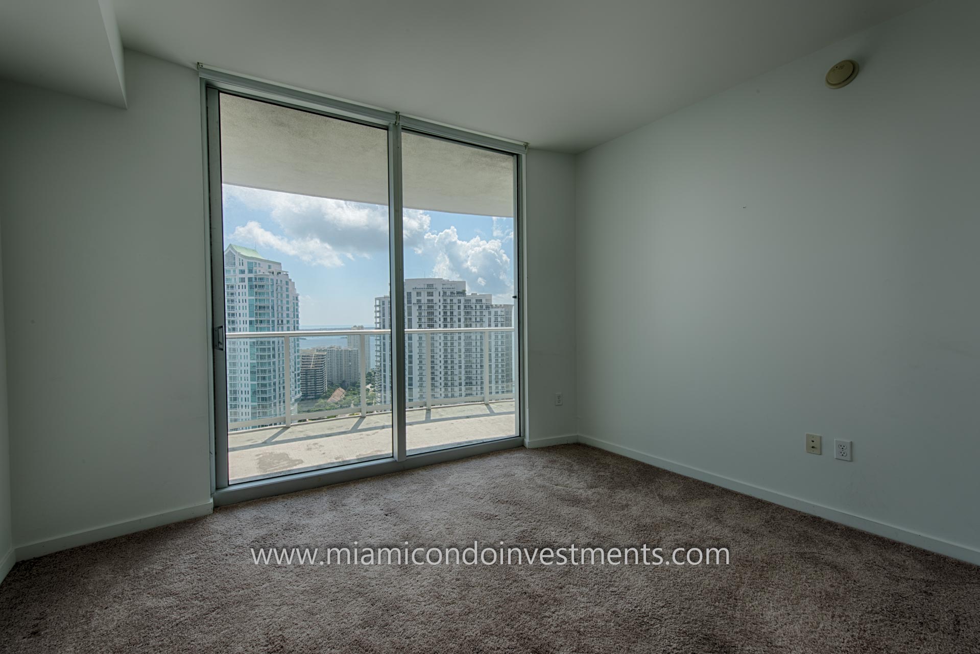 second bedroom with views of the Miami River, Brickell Key, Brickell, and Biscayne Bay second bedroom with views of the Miami River, Brickell Key, Brickell, and Biscayne Bay
