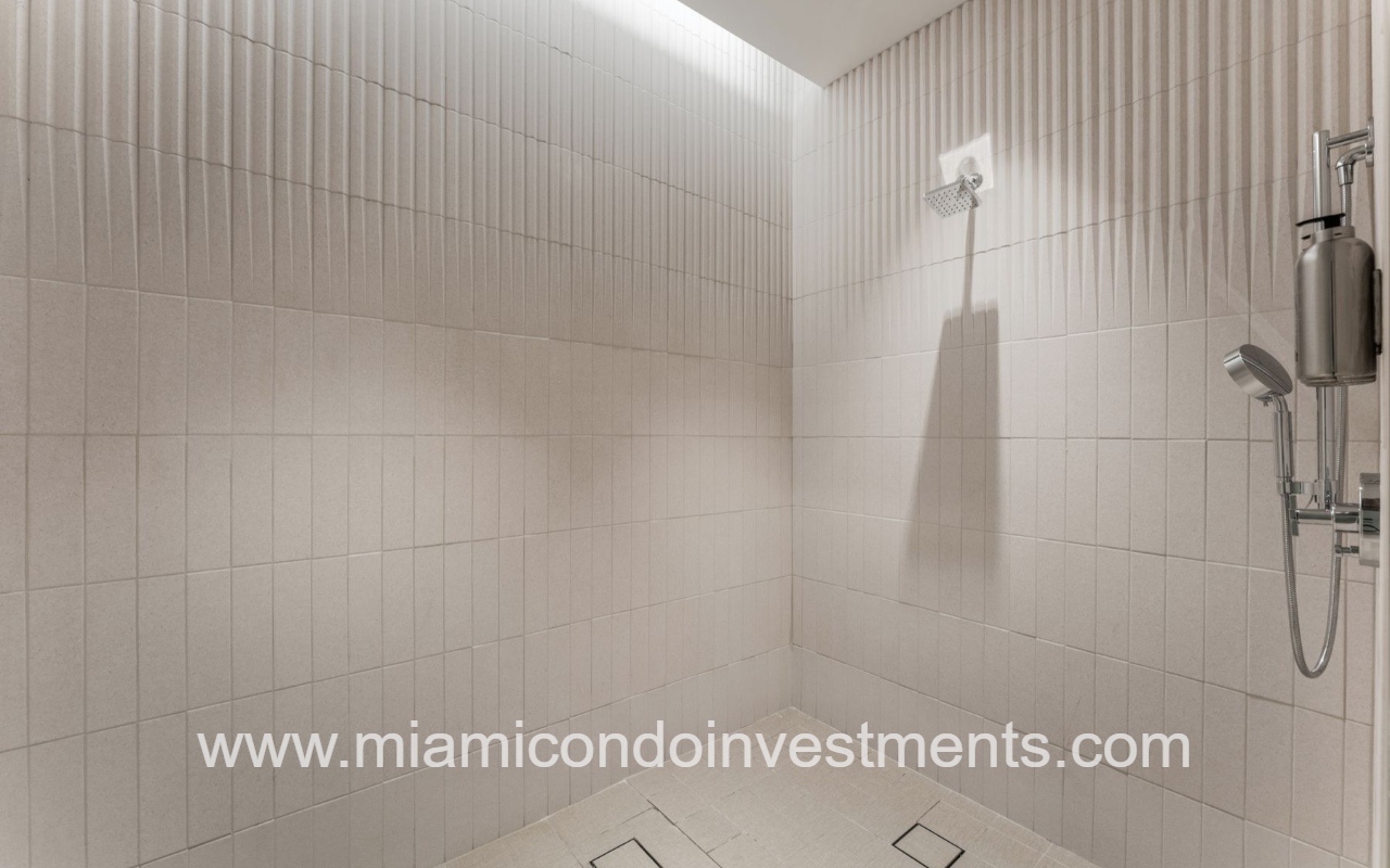 UNA Residences condominium building spa shower