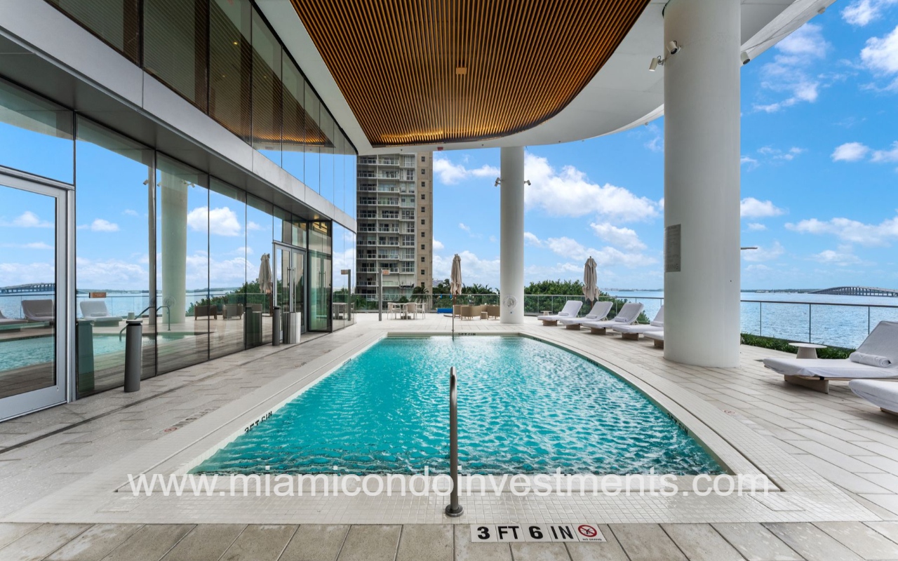 UNA Residences condominium building outdoor hotel pool on terrace with Biscayne Bay view