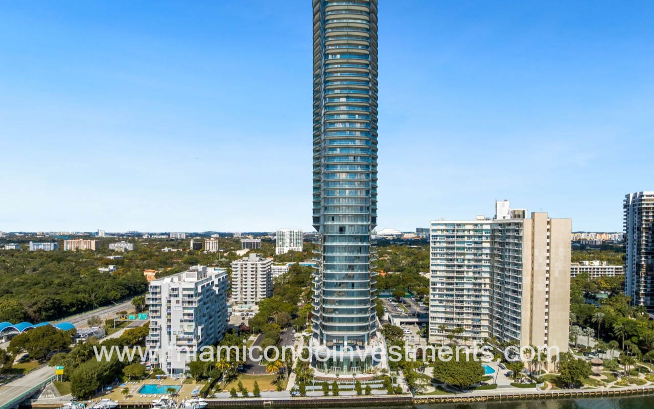 UNA Residences tall view facing condominium building from Biscayne Bay