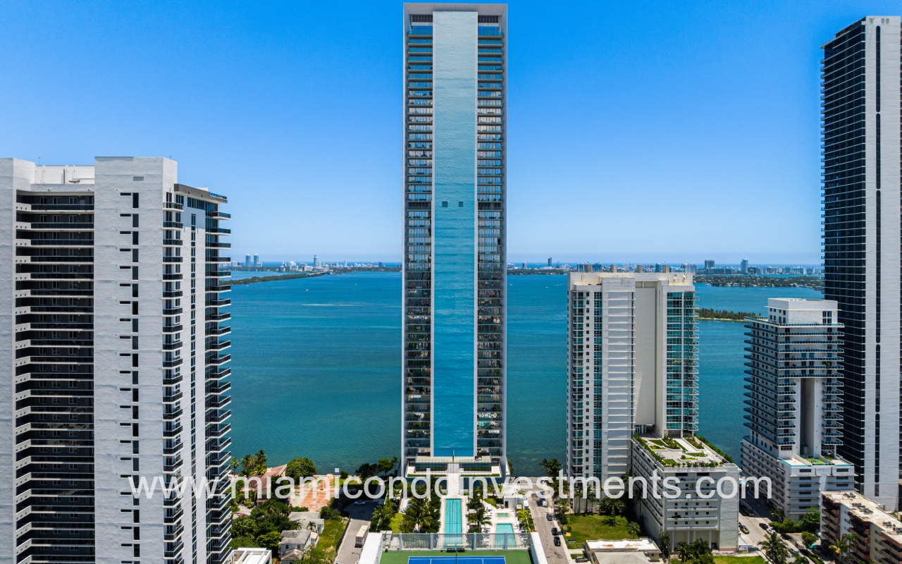 Missoni Baia drone facing front of building with bay view backdrop