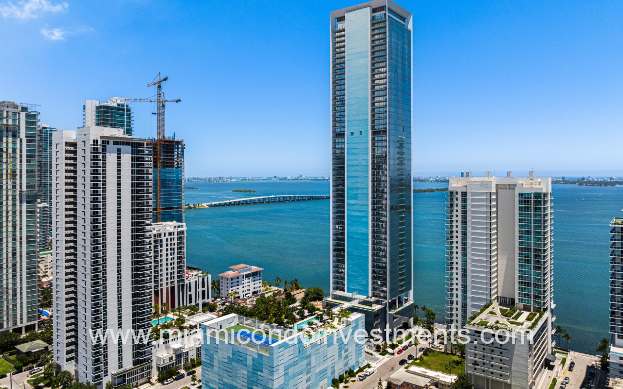 Missoni Baia drone facing front angle of building with bay view backdrop