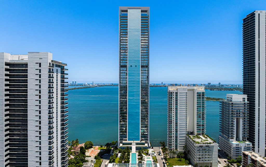 Missoni Baia drone top half of building exterior with bay view backdrop