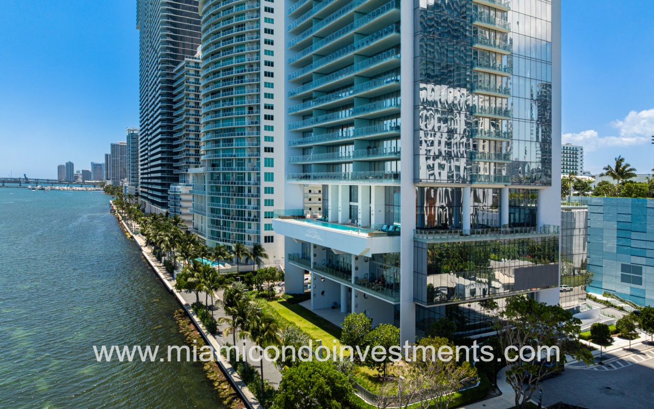 Missoni Baia drone closeup view of building lower exterior from the waterway
