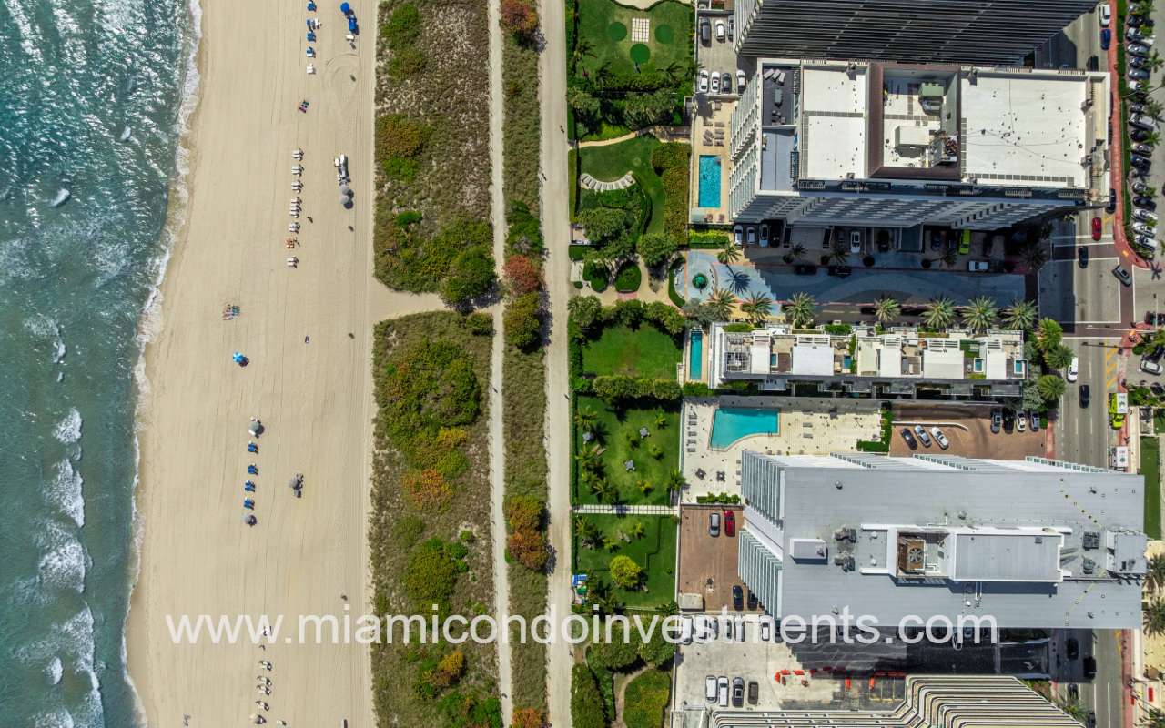 Ocean Seven drone downward facing view of top of condo building and beachfront area