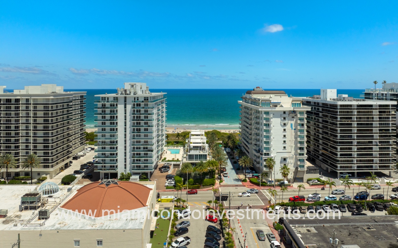 Ocean Seven drone view facing condo building on blue ocean