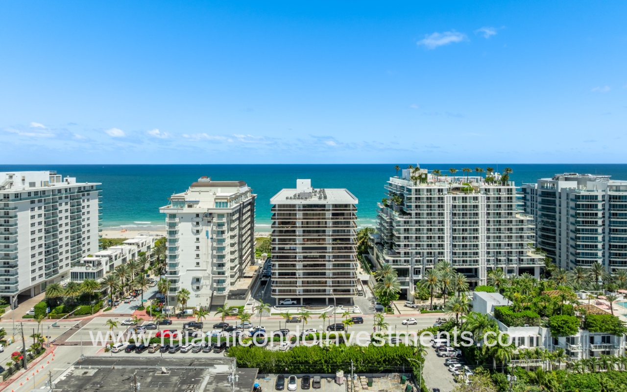 The Waves drone directly facing condo building and blue ocean backdrop