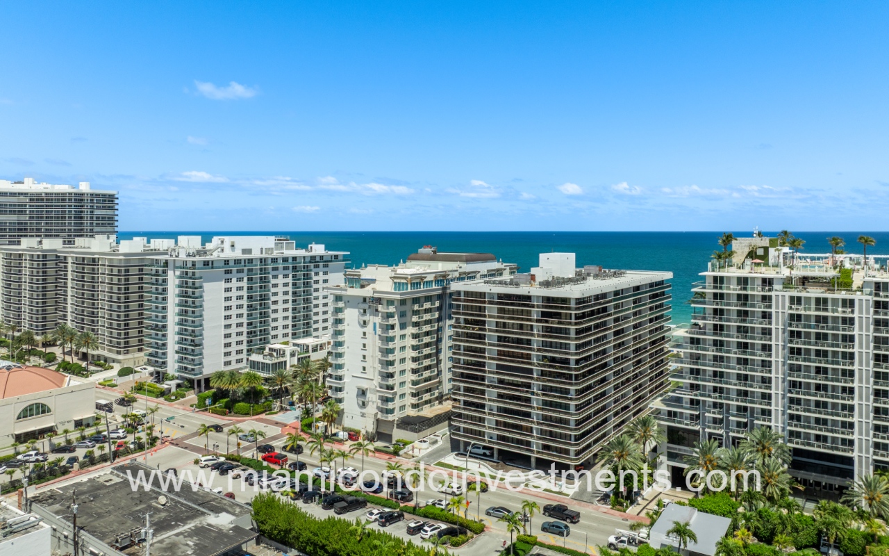 The Waves drone directly facing angle condo building and surrounding buildings