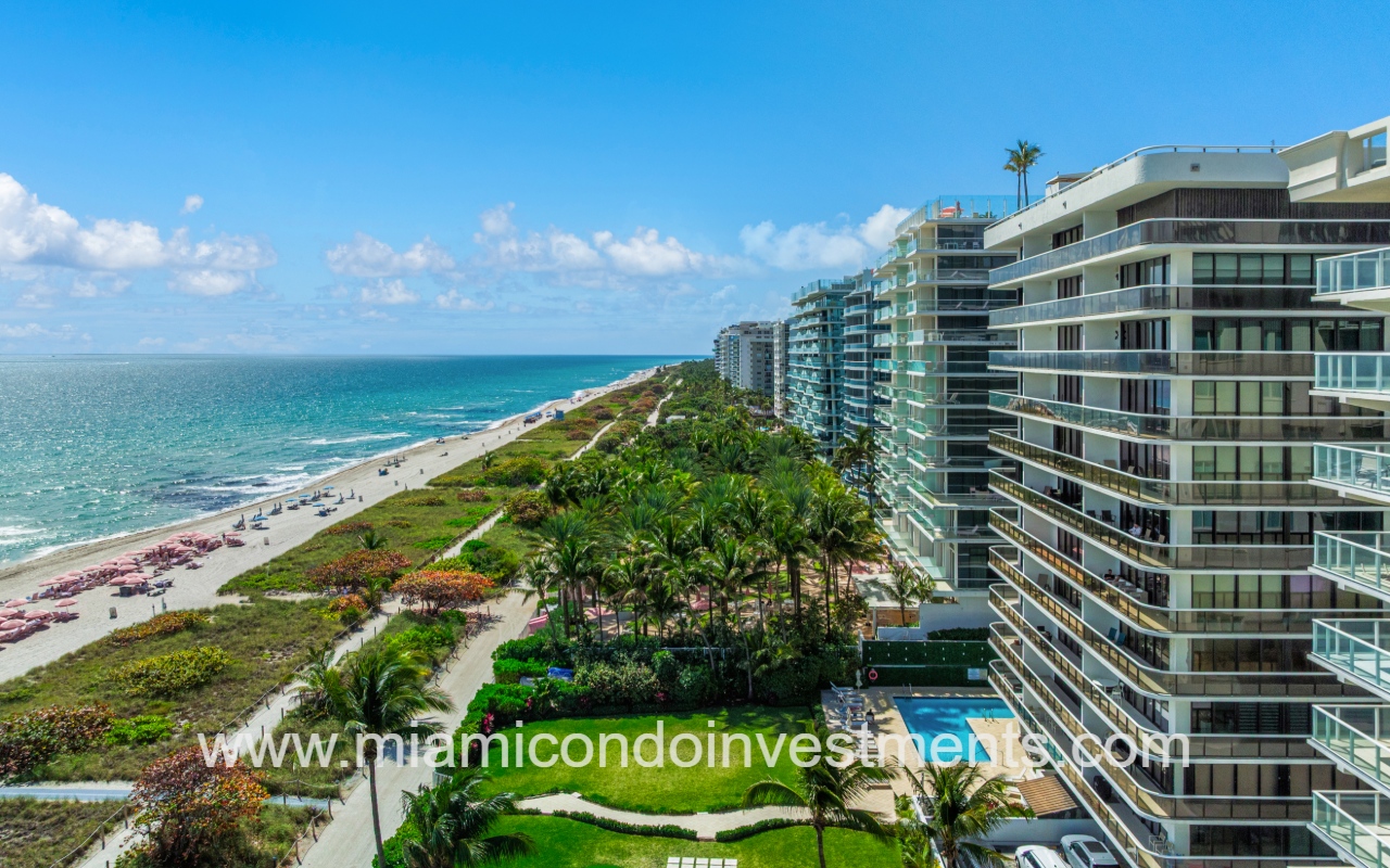 The Waves drone profile view of condo building and beach shoreline