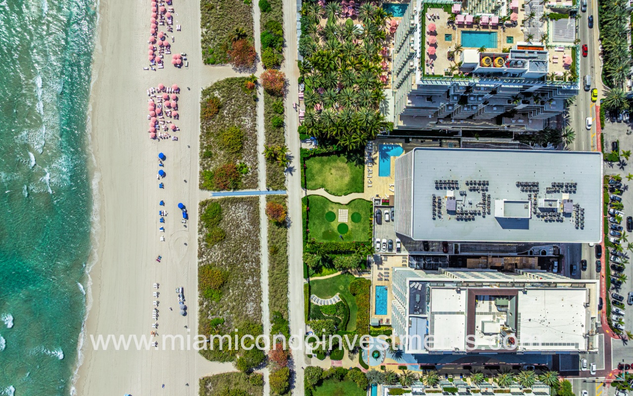 The Waves drone view overlooking condo building rooftop and beach