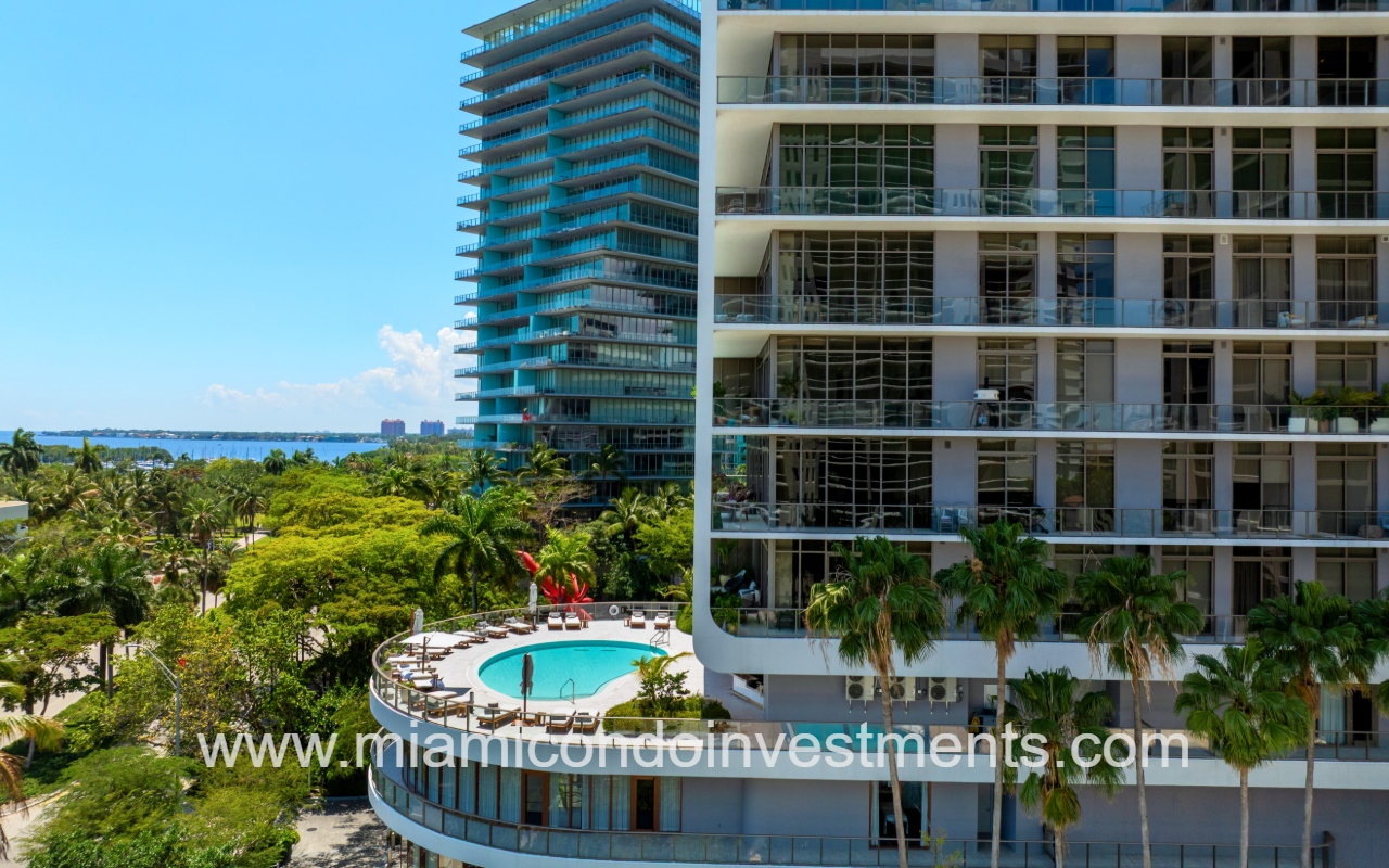 Mr. C Residences drone facing side angle of building and pool