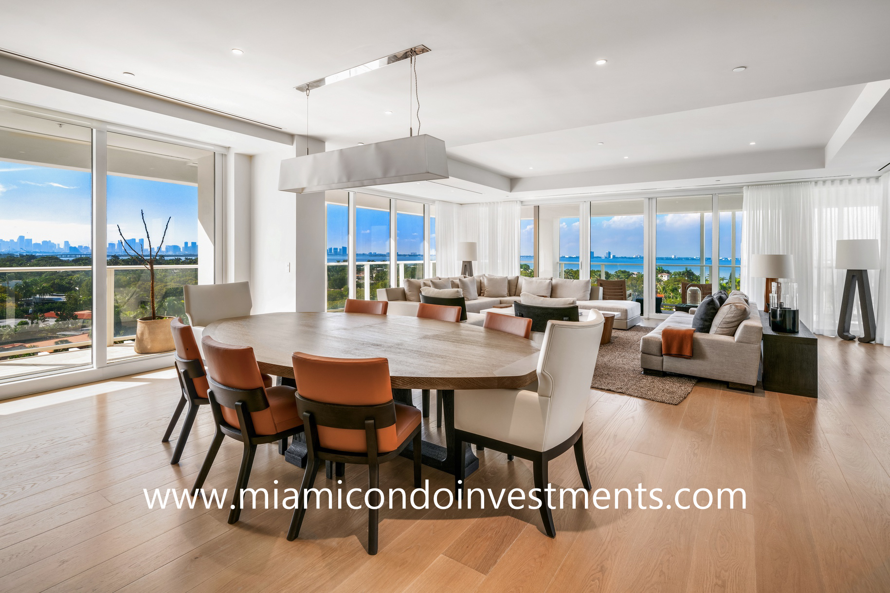 dining room and living room with direct water views