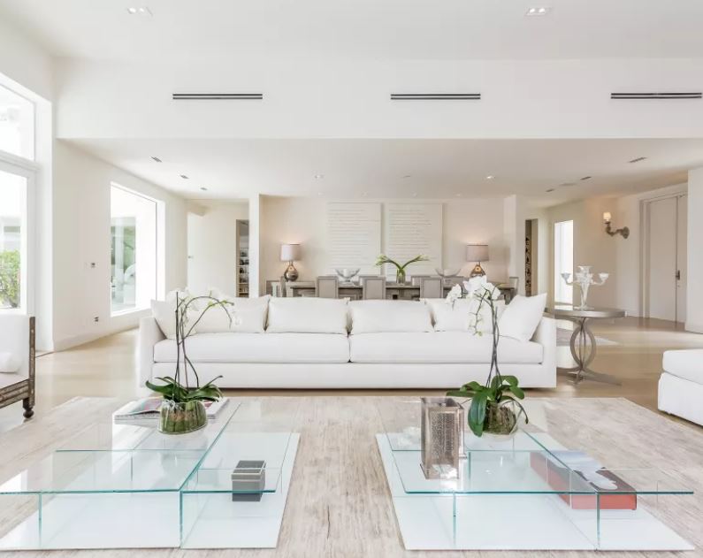 Shakira's Modern Family Room with Venetian Plastered Walls and Silver Finishes. Shakira's family room and dining room.