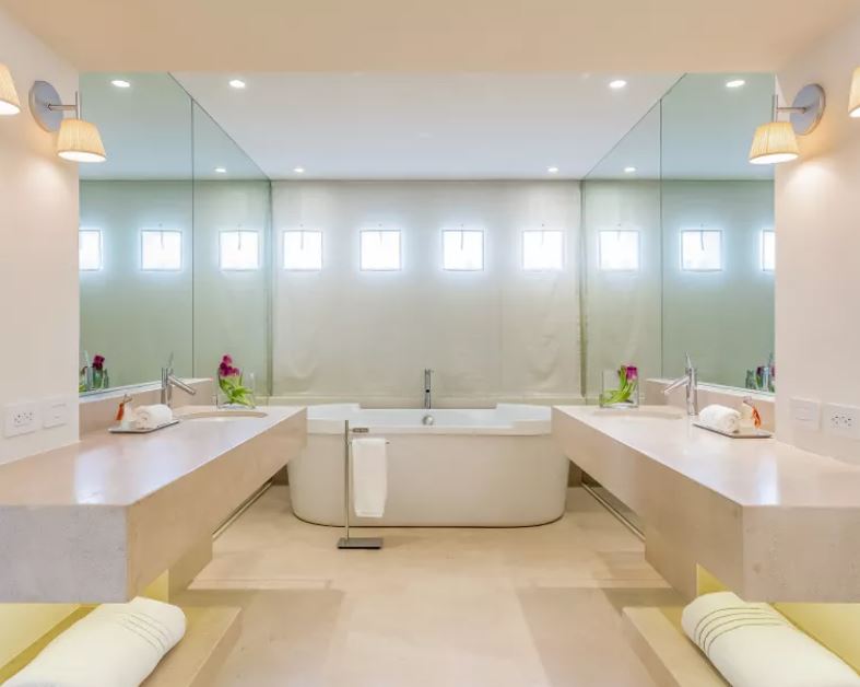 Custom bathroom with double vanities, and jacuzzi tub. 