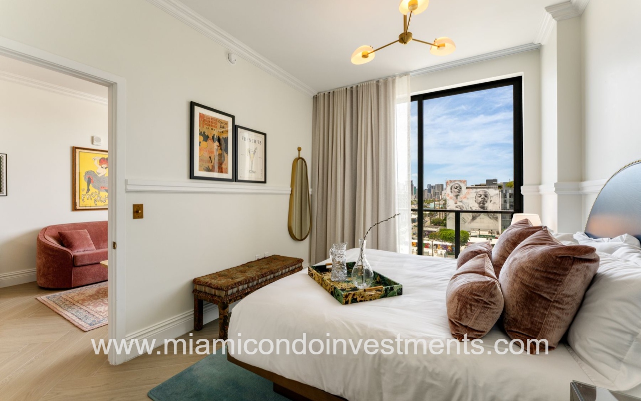 NoMad Wynwood 1-bedroom view of bed and glass sliding door