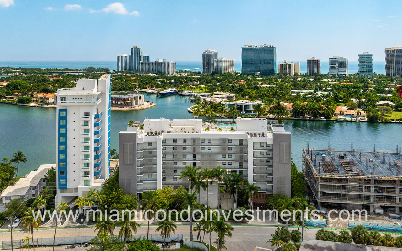 Sereno Residences in Bay Harbor Islands facing front of building with bay view behind