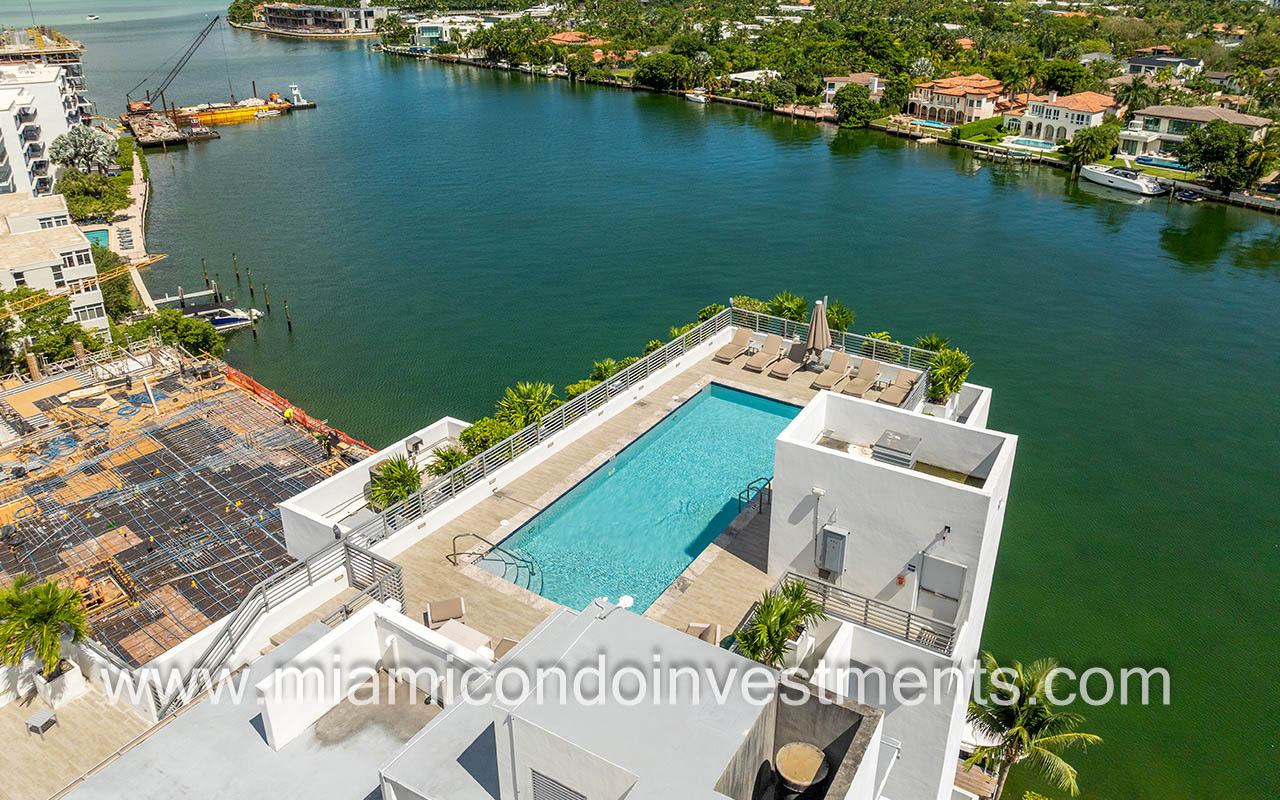 Harbour Park condo drone of pool and sundeck with water view