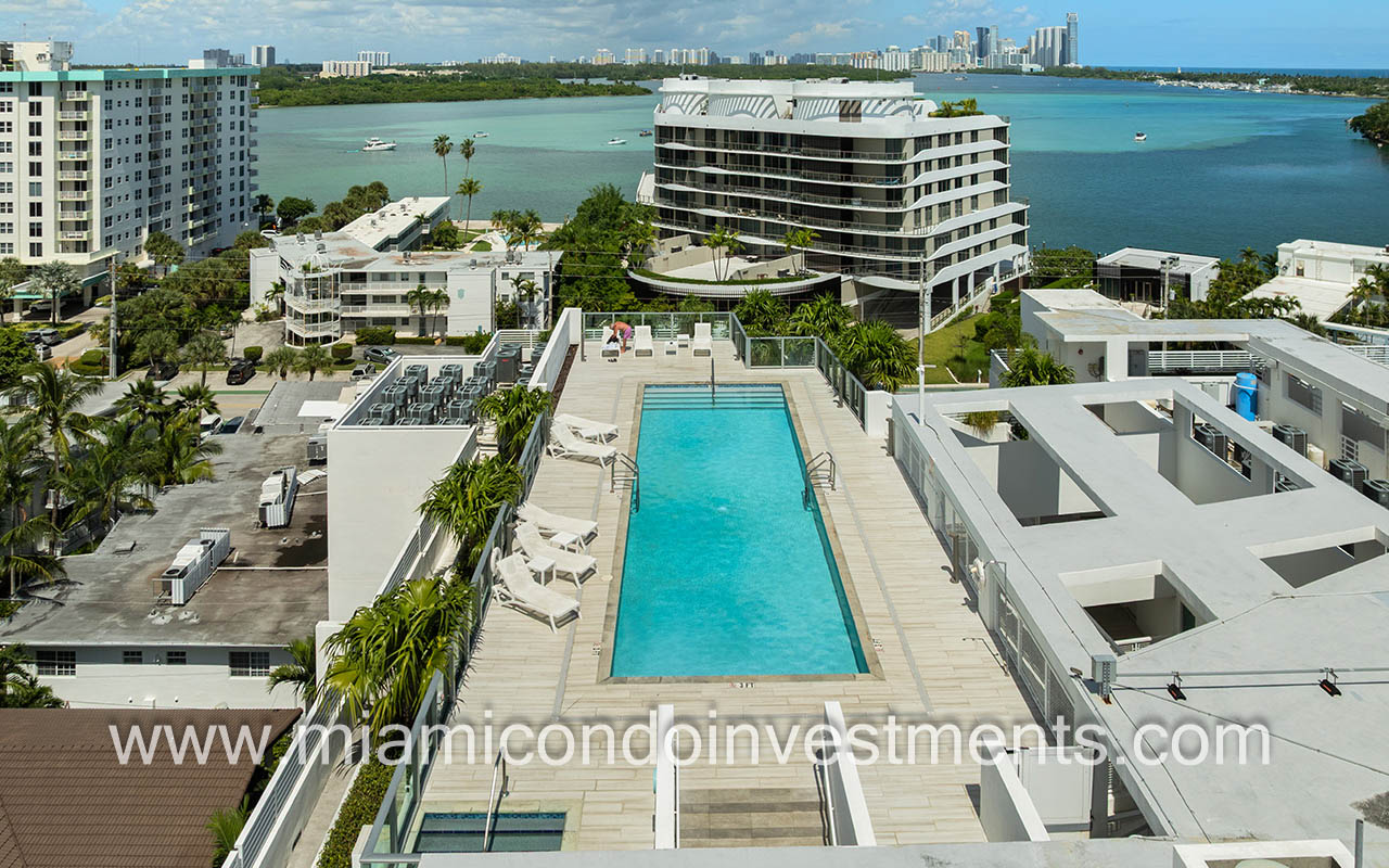 The Palms condos drone of building pool and sundeck with bay view