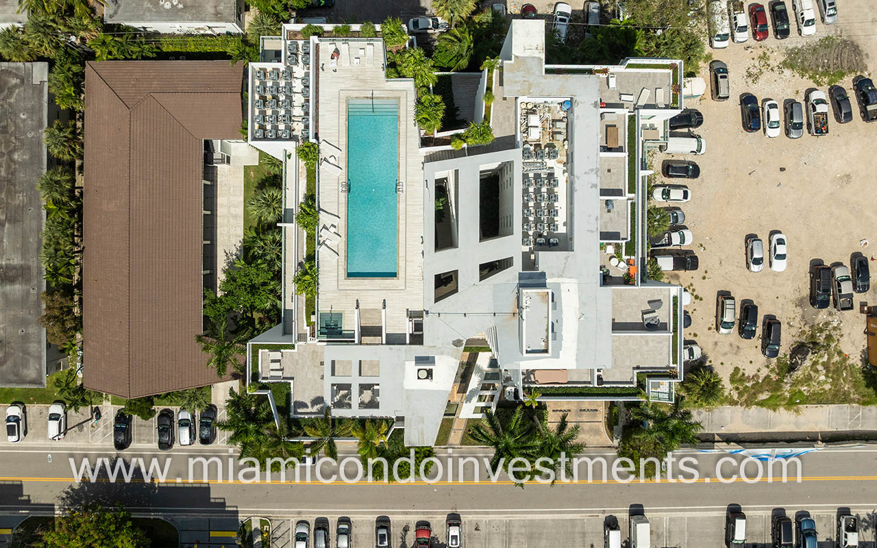 The Palms condos drone of building rooftop with pool and sundeck
