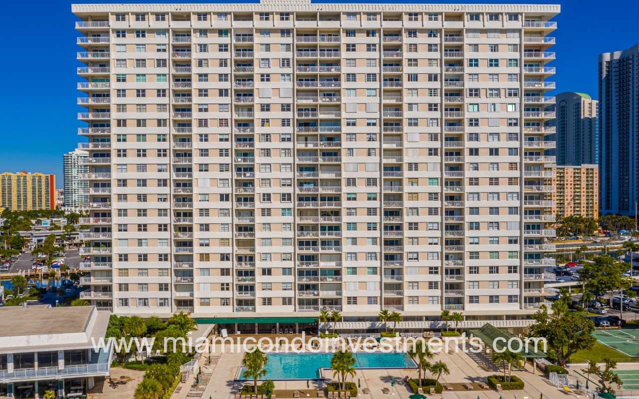 Arlen House Condo drone facing building and pool closeup
